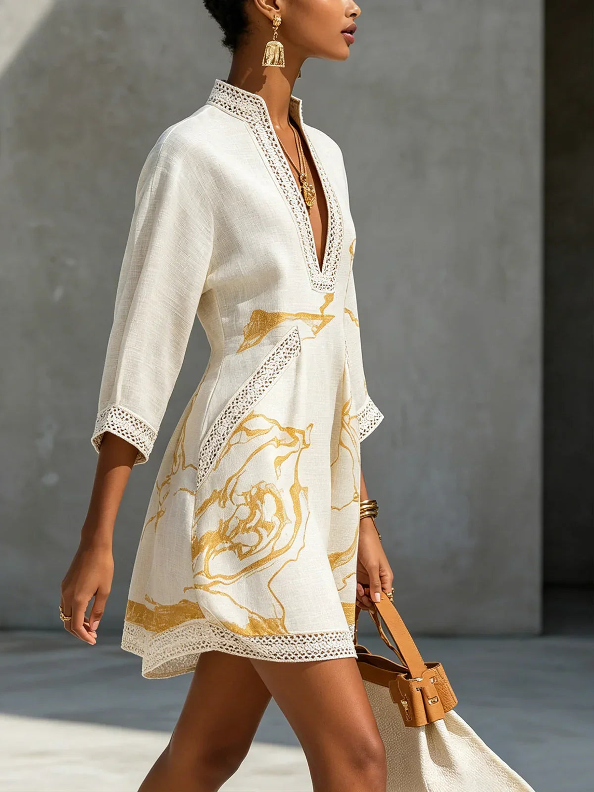 Renata - Short lace dress with gold print and deep V neckline