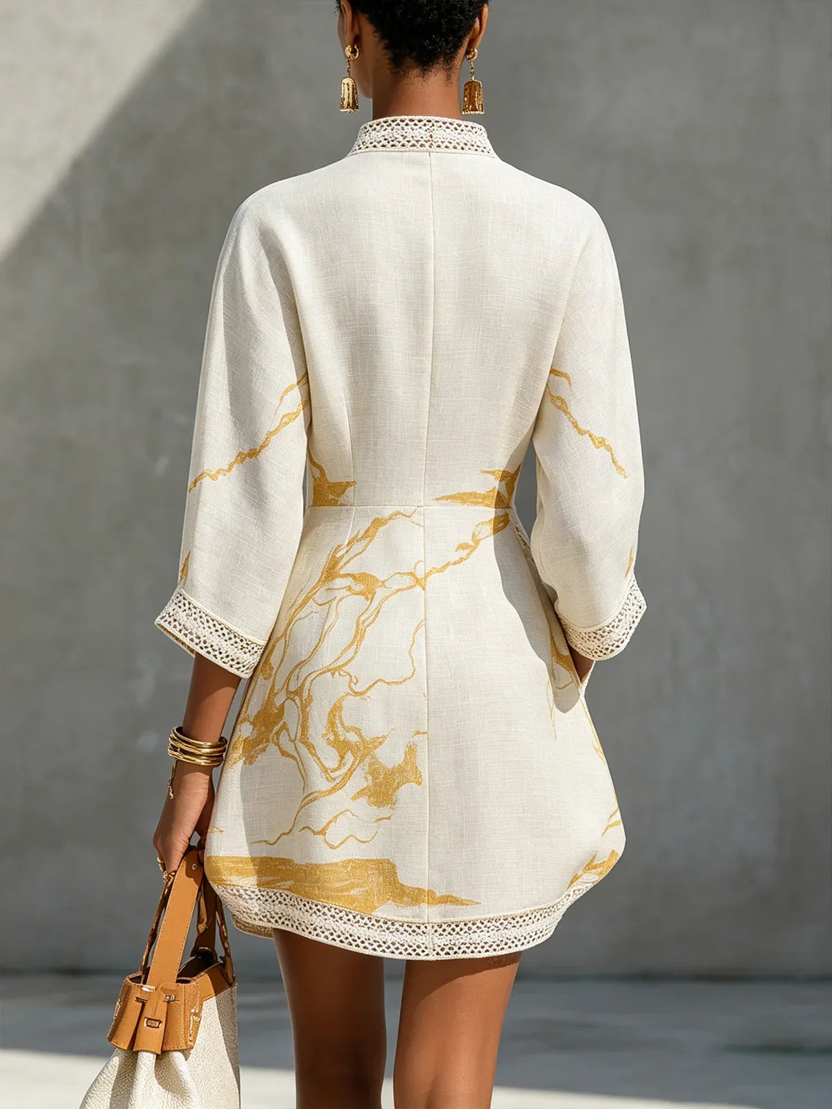 Renata - Short lace dress with gold print and deep V neckline