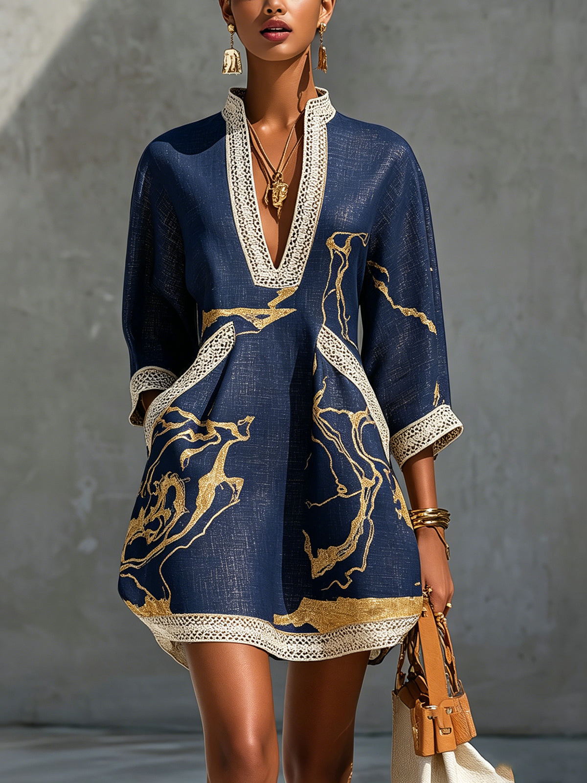 Renata - Short lace dress with gold print and deep V neckline