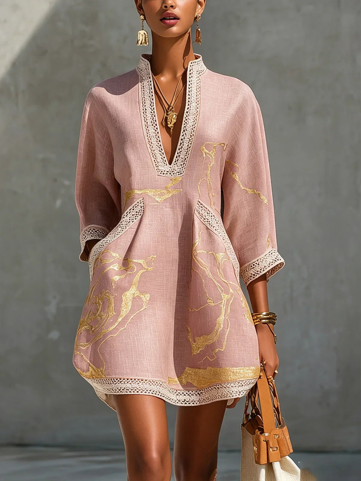Renata - Short lace dress with gold print and deep V neckline