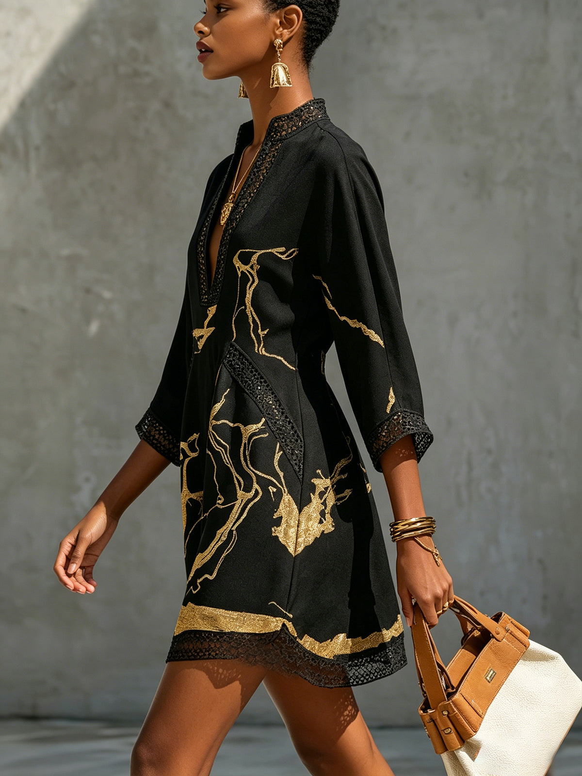 Donatella | Mini black dress with golden marble print and crochet lace